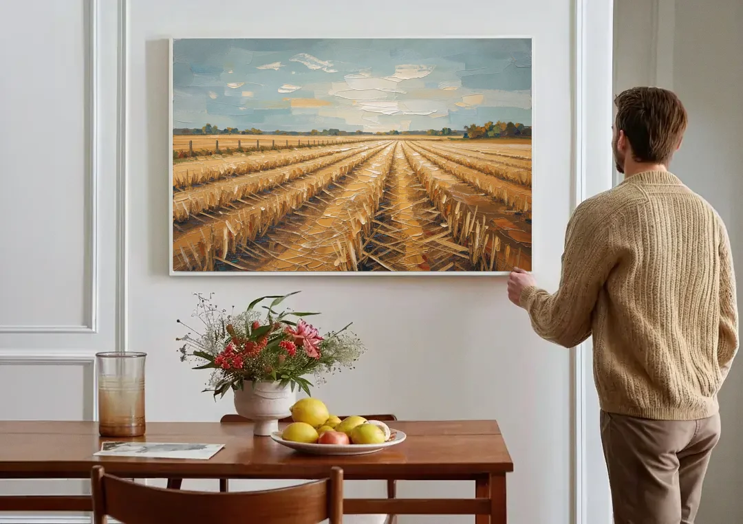 Harvested Stubble Field Rows Under a Pale Sky canvas wall art above a dining table
