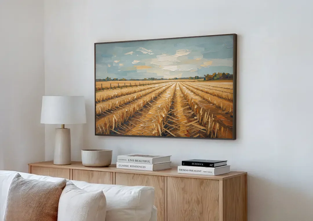 Harvested Stubble Field Rows Under a Pale Sky canvas wall art above a wooden sideboard next to a sofa