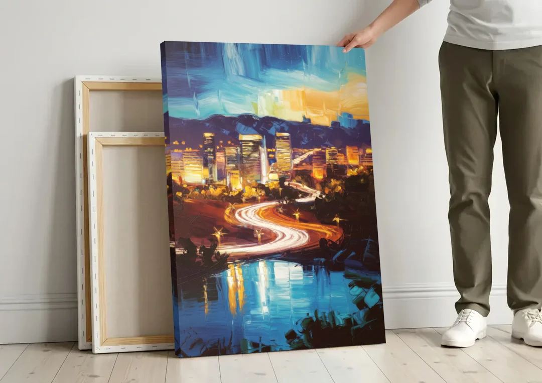 Henderson Nightscape canvas wall art leaning against a wall next to blank canvases