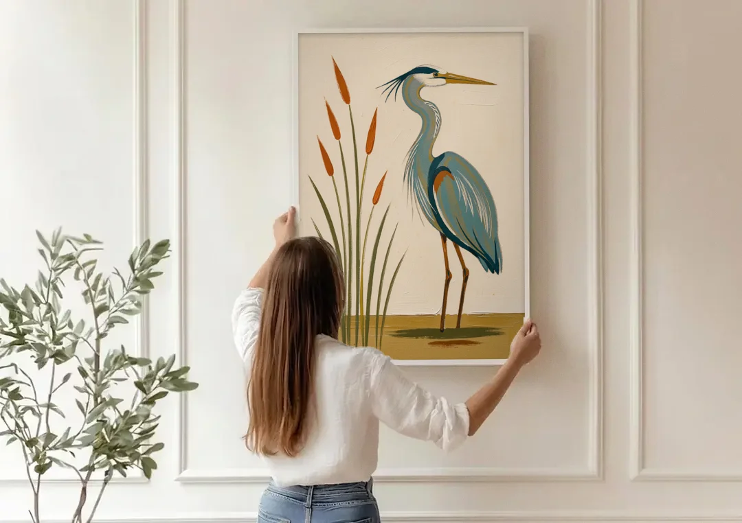 Heron Wall Art of a Blue Heron Among Cattails canvas wall art being hung on a paneled wall