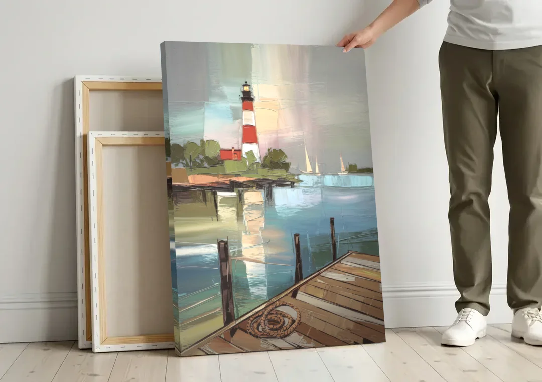 Hilton Head Island Coastal Lighthouse canvas wall art leaning against a wall next to blank canvases
