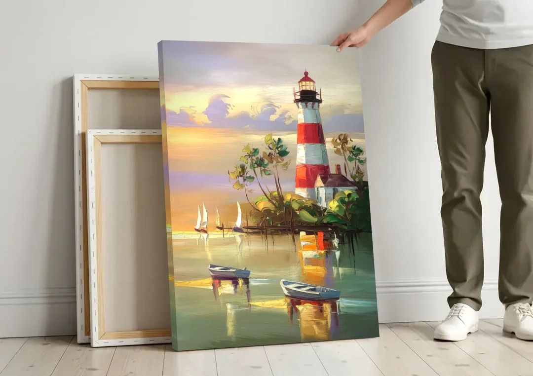 Hilton Head Island Coastal Lighthouse Nautical canvas wall art leaning against a wall next to blank canvases