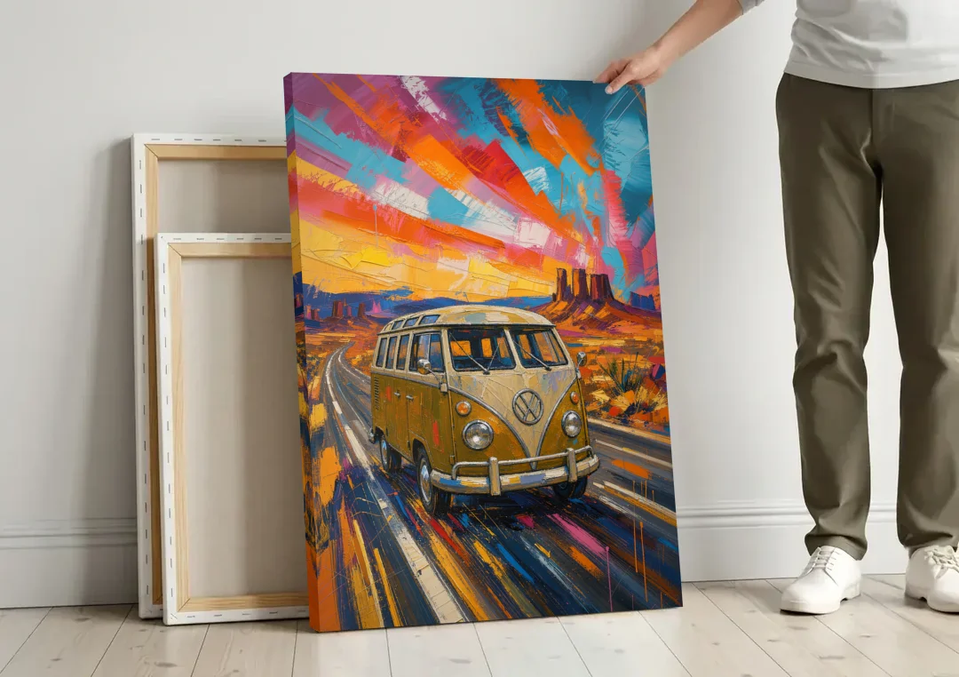Hippie Wall Art Camper Van on a Desert Highway canvas wall art leaning against a wall next to blank canvases