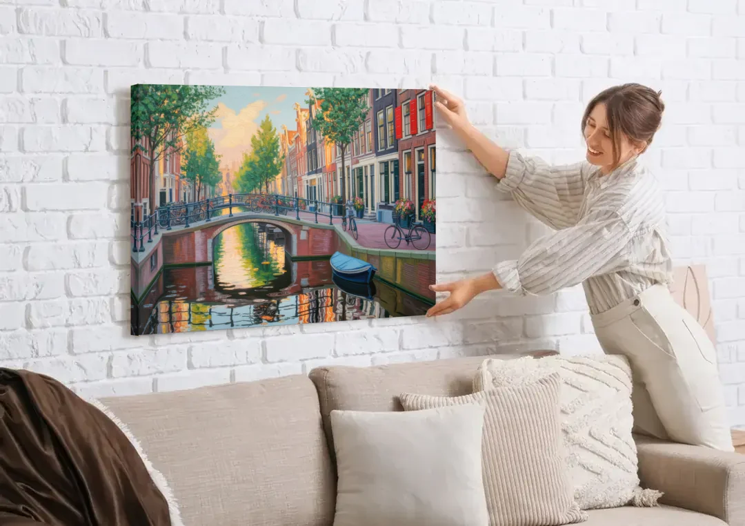 Historic Jordaan canvas wall art being hung on a white brick wall above a sofa