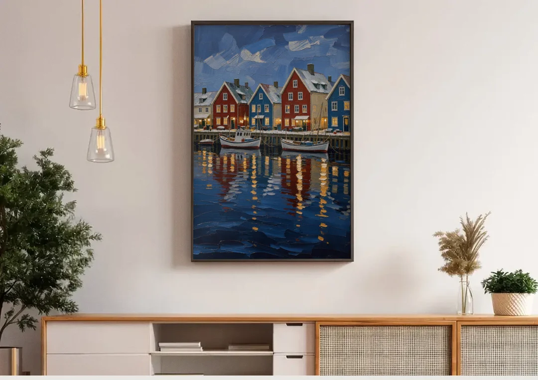 Holiday Snowy Harbor Fishing Village canvas wall art above a wooden sideboard under pendant lights