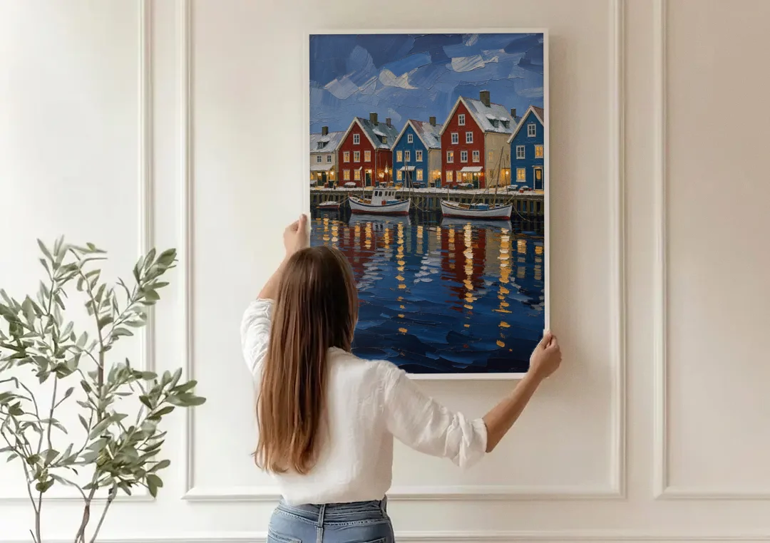 Holiday Snowy Harbor Fishing Village canvas wall art being hung on a paneled wall
