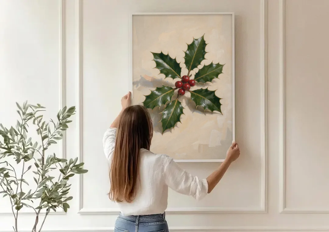 Holly Wall Art with Red Berries on Cream canvas wall art being hung on a paneled wall