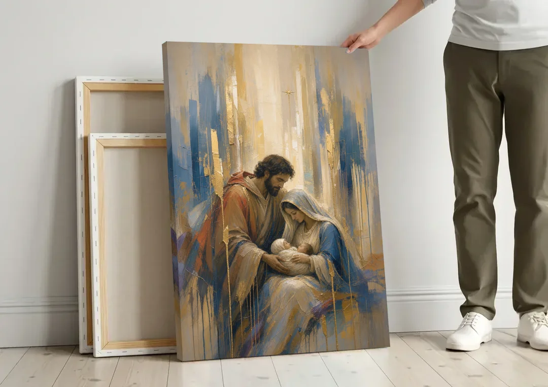 Holy Family Canvas in Indigo and Gold canvas wall art leaning against a wall next to blank canvases