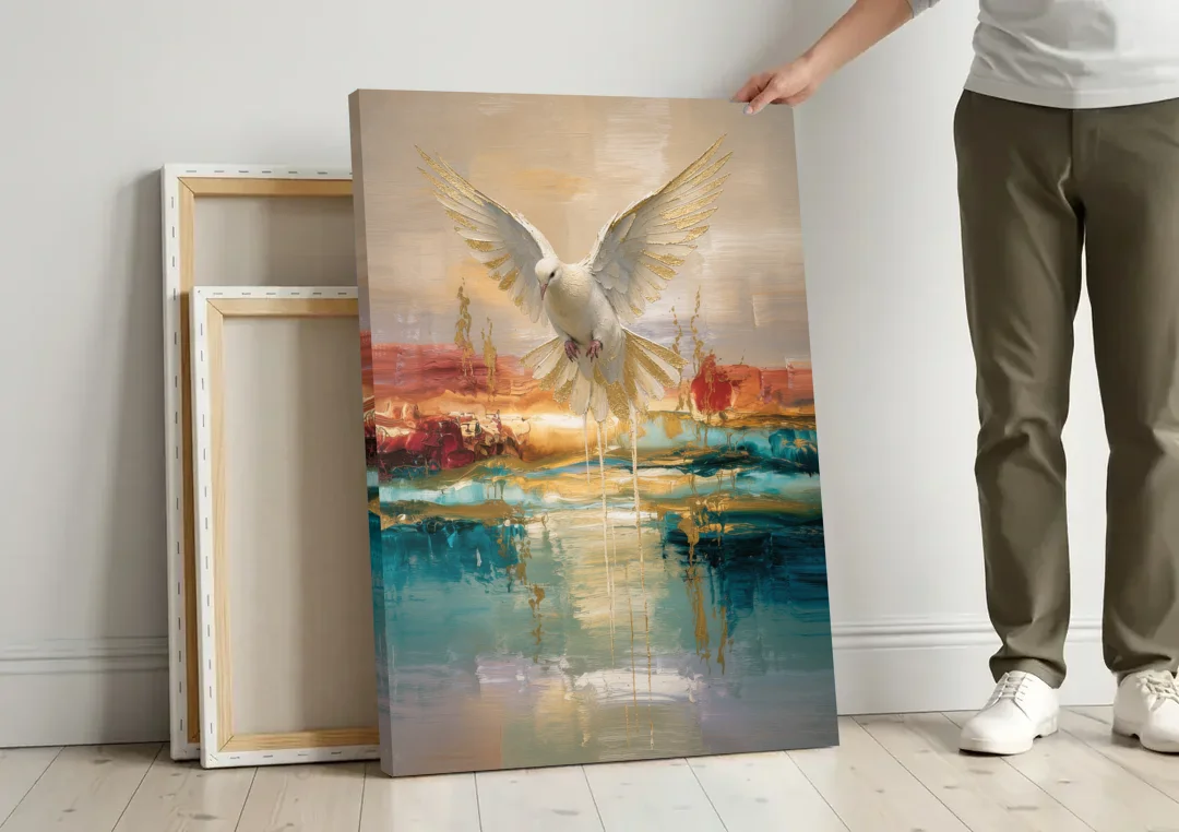 Holy Spirit Dove Painting Descending in Gold canvas wall art leaning against a wall next to blank canvases