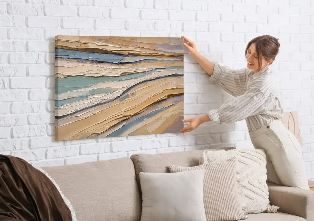 Horizontal Abstract Painting of Sandstone Strata canvas wall art being hung on a white brick wall above a sofa