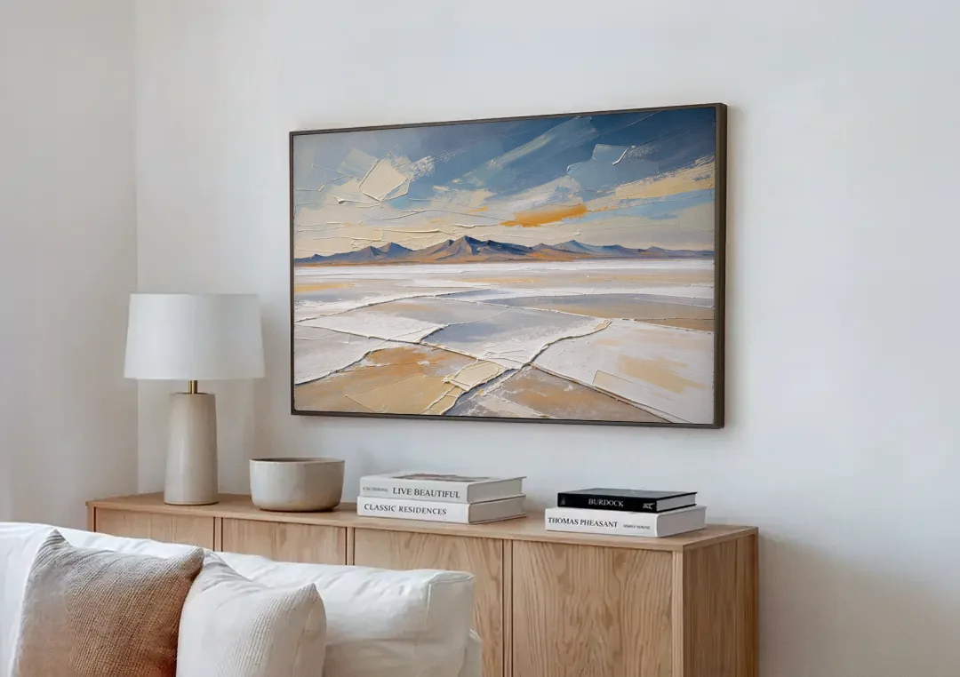 Horizontal Canvas Wall Art of a Cracked Salt Flat canvas wall art above a wooden sideboard next to a sofa