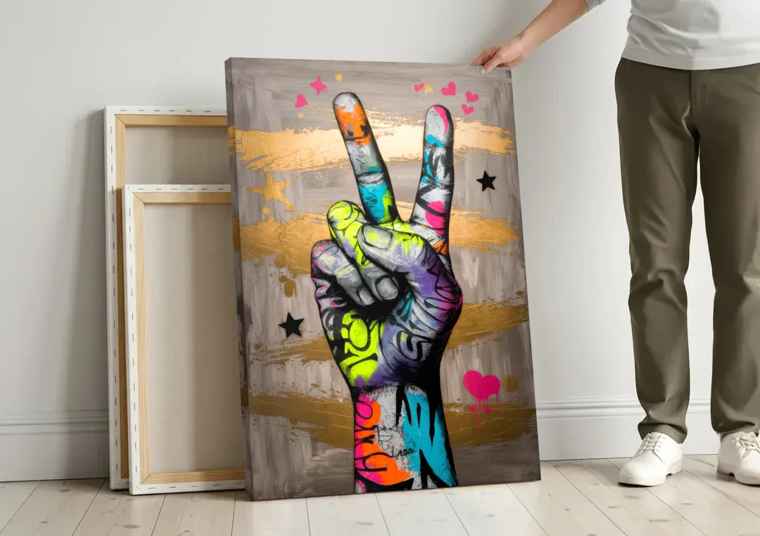 Houston Bold Graffiti canvas wall art leaning against a wall next to blank canvases