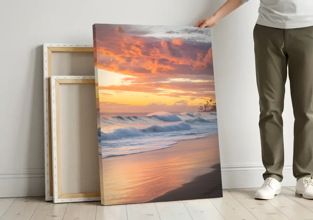Huntington Beach Golden Hour canvas wall art leaning against a wall next to blank canvases