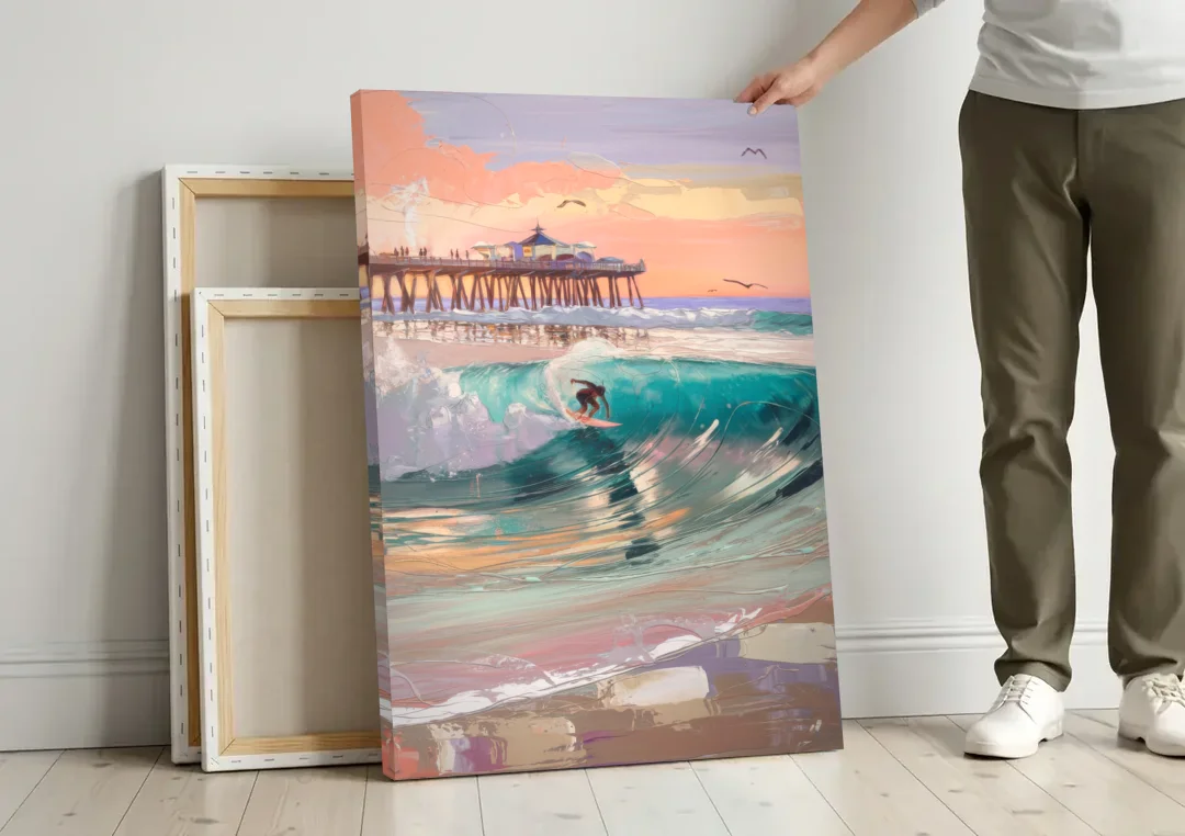 Huntington Beach Surfing Scene canvas wall art leaning against a wall next to blank canvases