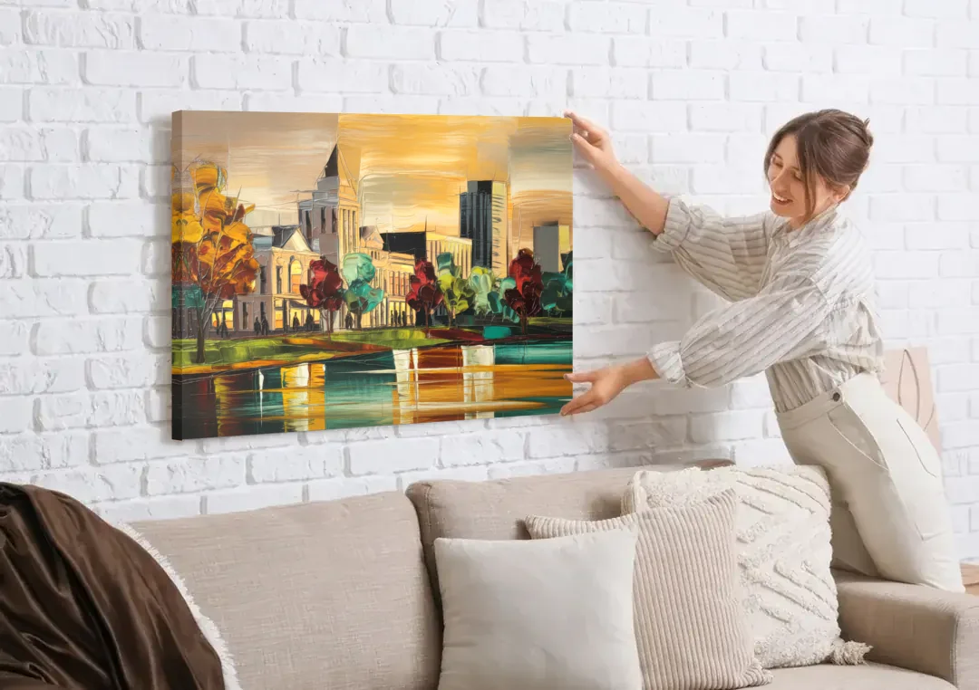 Huntsville Historic Downtown canvas wall art being hung on a white brick wall above a sofa