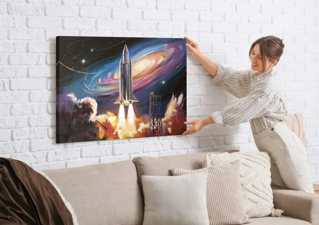 Huntsville Space Center Tribute canvas wall art being hung on a white brick wall above a sofa