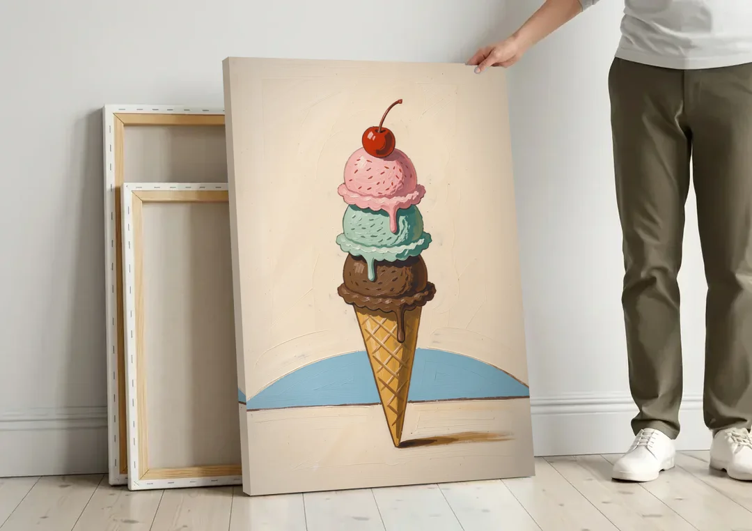 Ice Cream Cone Painting with a Cherry on Top canvas wall art leaning against a wall next to blank canvases