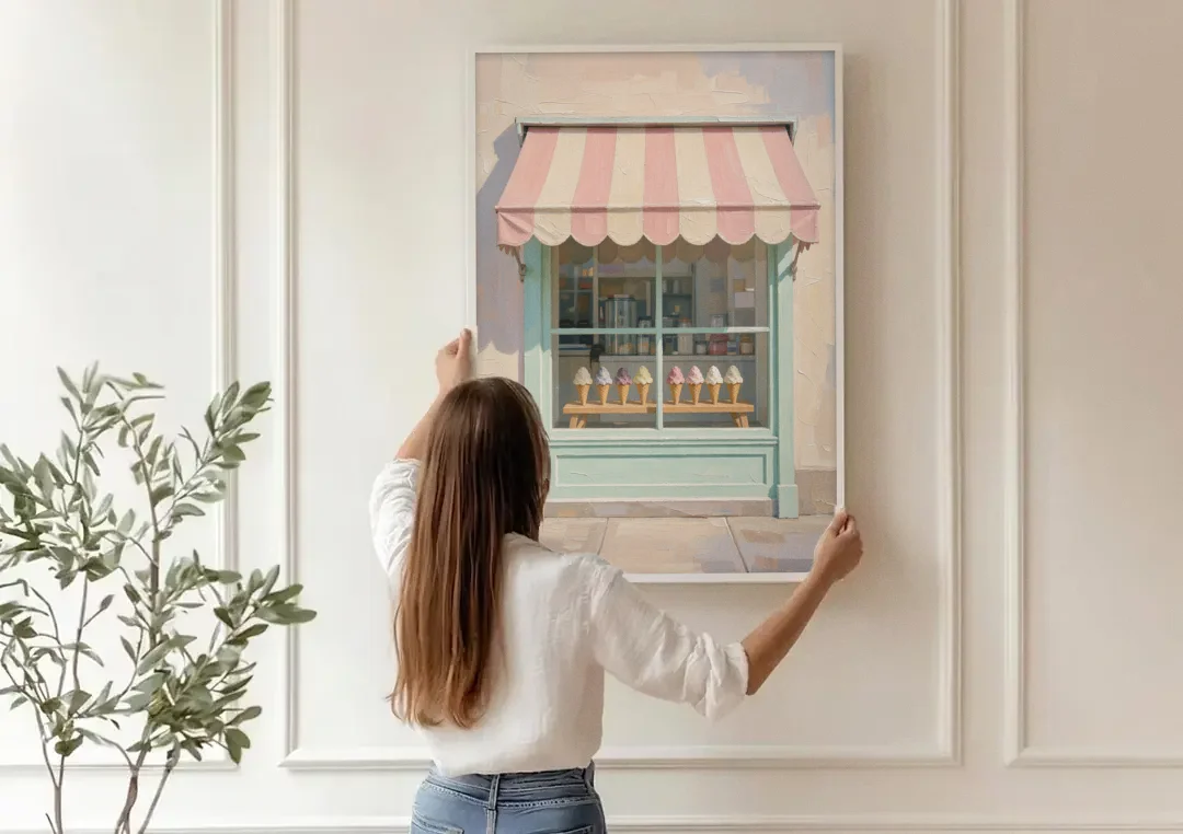 Ice Cream Shop Decor of a Striped Awning Window canvas wall art being hung on a paneled wall
