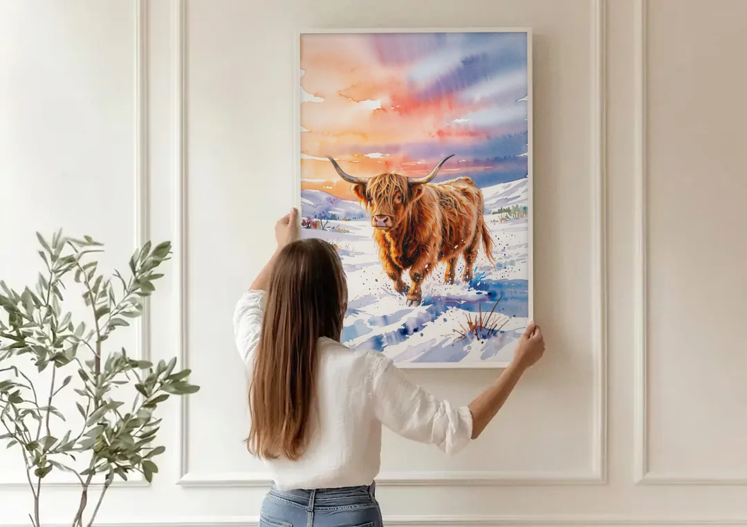Iconic Highland Cow in Snow canvas wall art being hung on a paneled wall