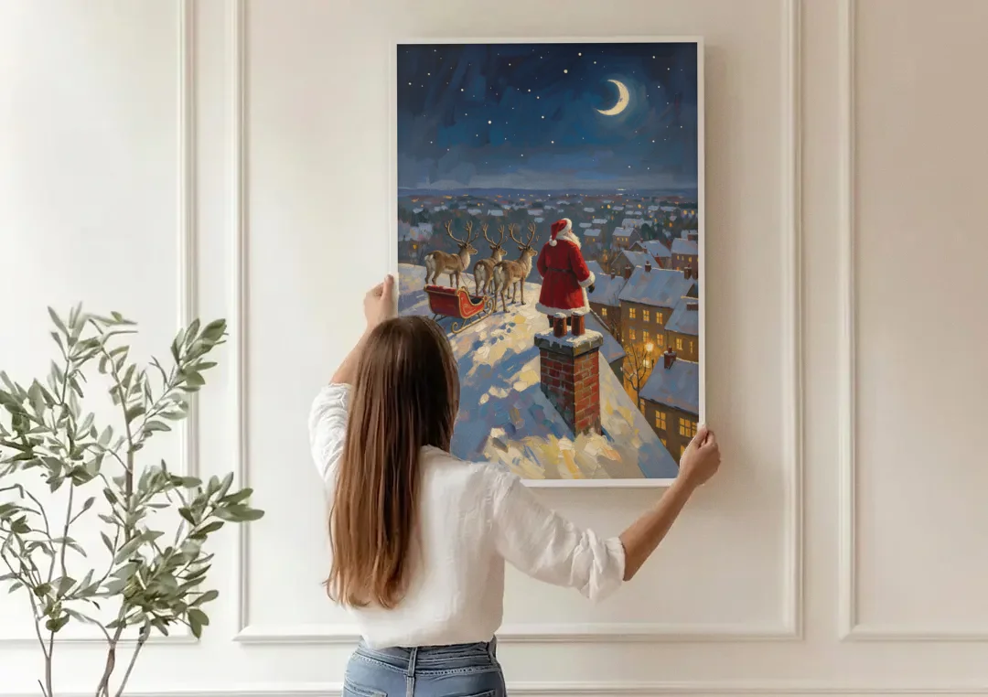 Impressionist Christmas Painting of Santa on the Rooftop canvas wall art being hung on a paneled wall