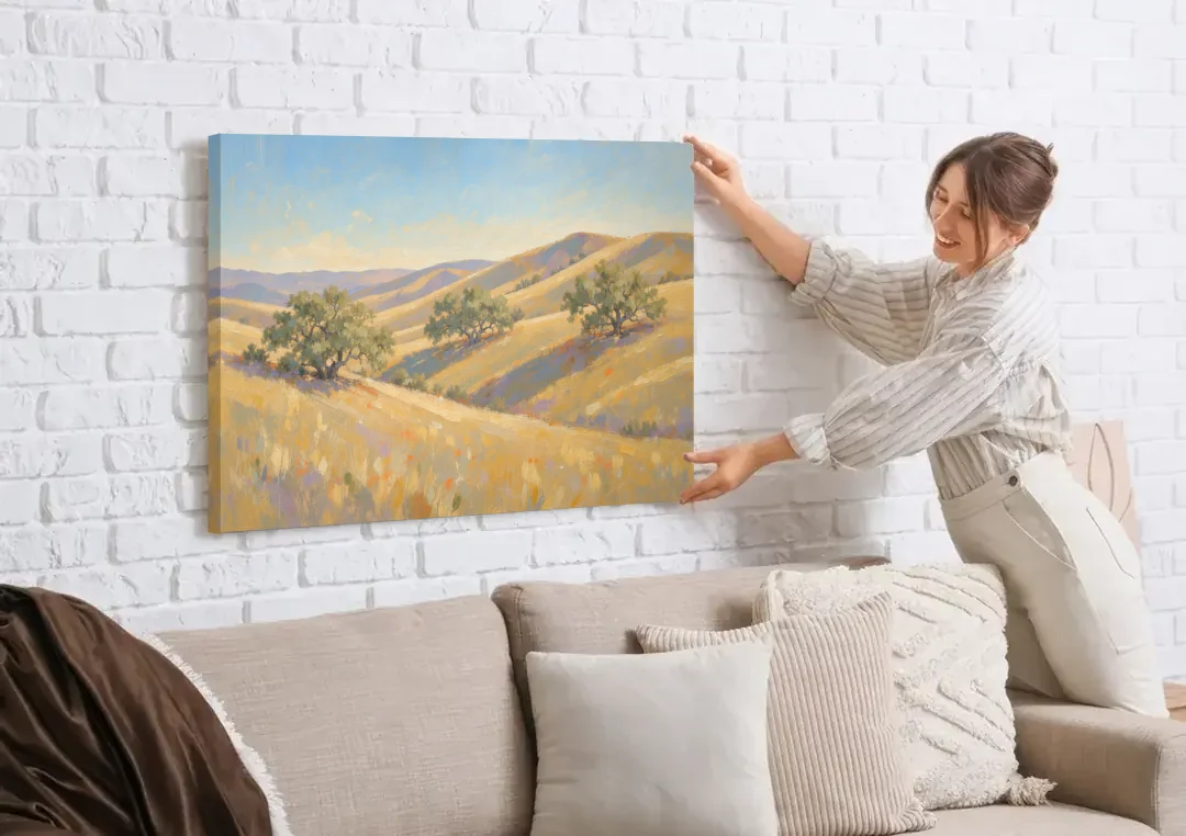 Impressionist Landscape Painting with Golden Oak Hills canvas wall art being hung on a white brick wall above a sofa