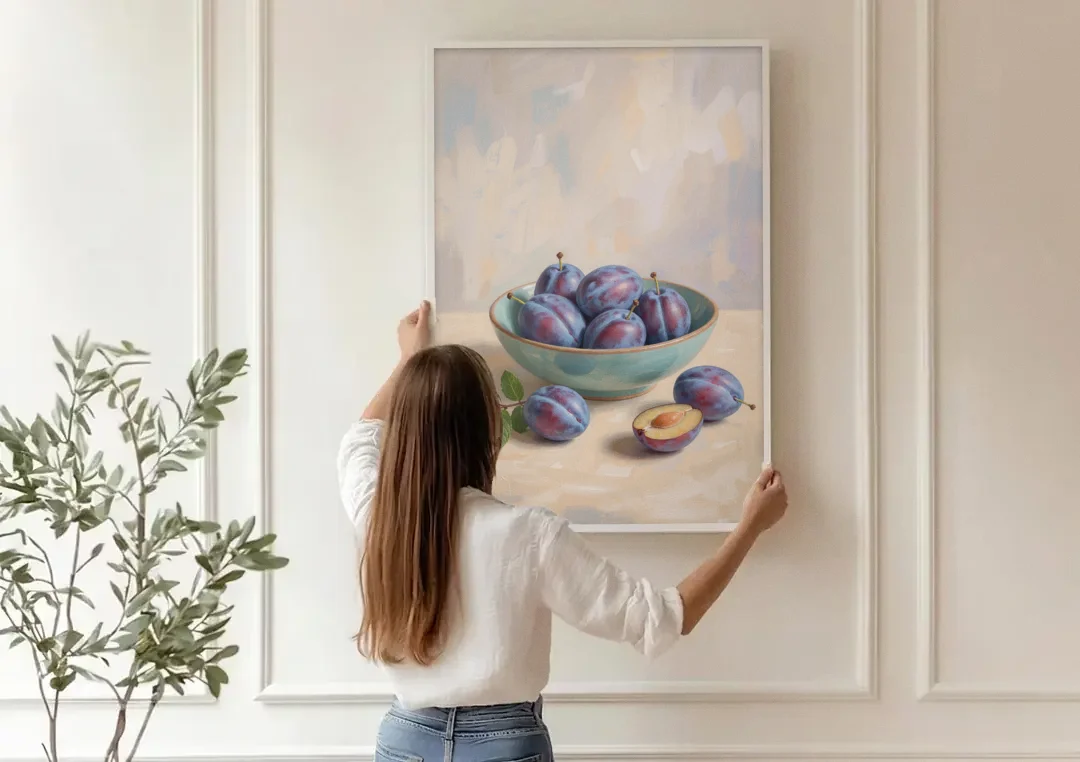 Impressionist Still Life Painting with Plums canvas wall art being hung on a paneled wall