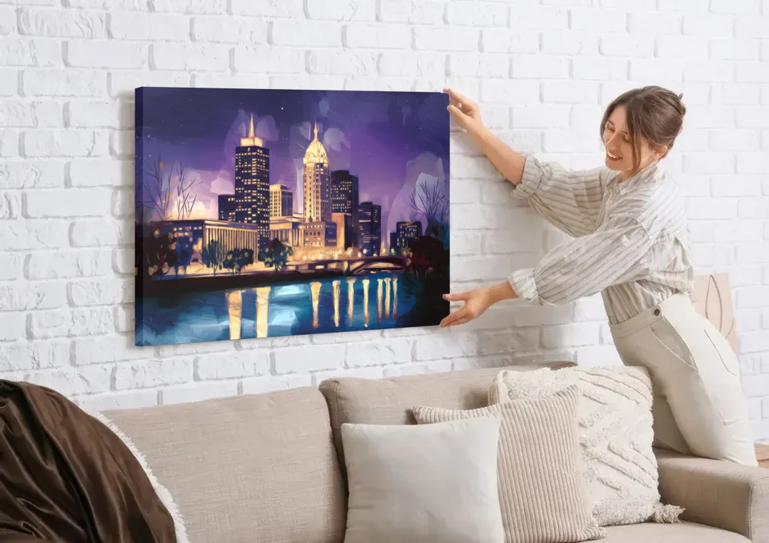 Indianapolis Nighttime Skyline canvas wall art being hung on a white brick wall above a sofa