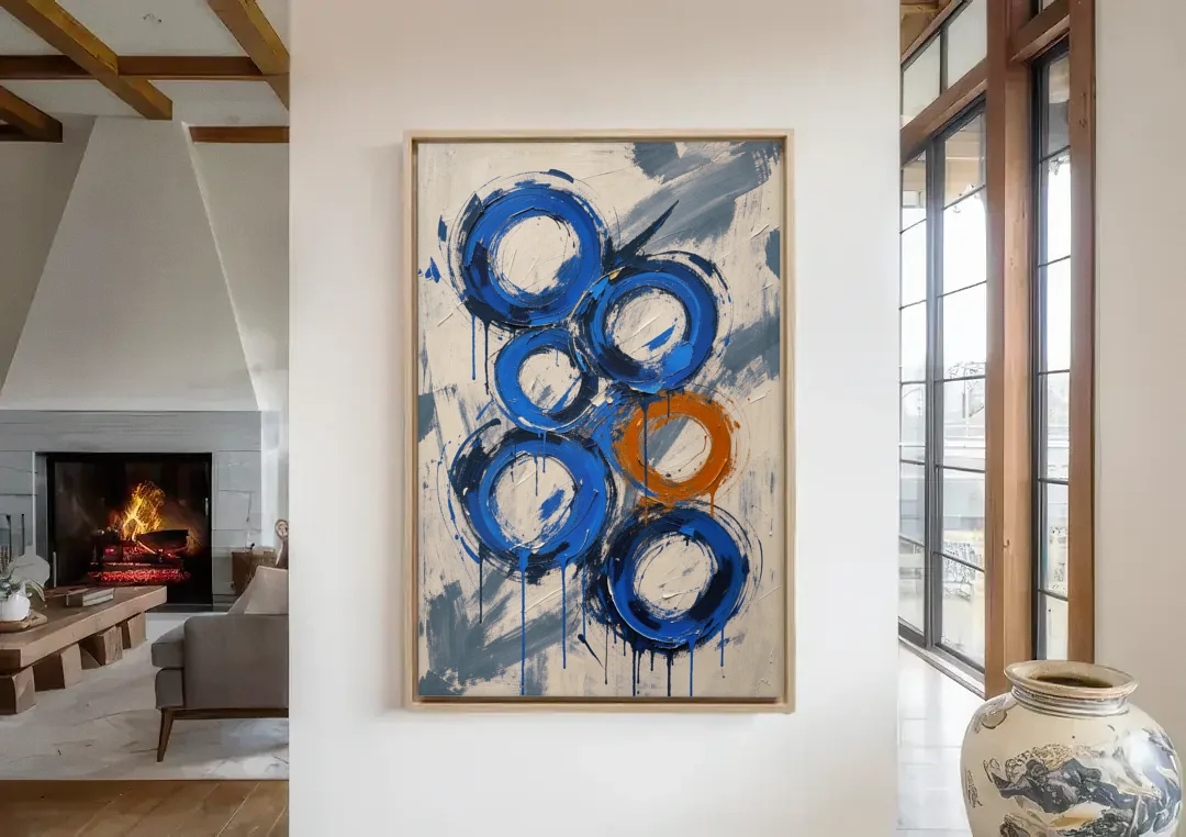 Indigo Wall Art with Five Dripping Rings canvas wall art in a living room with a fireplace