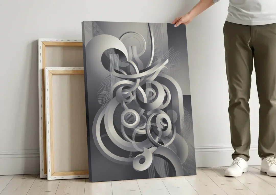 Interwoven Serenity Grey and White Abstract canvas wall art leaning against a wall next to blank canvases