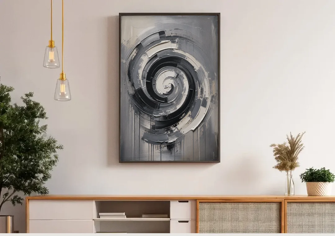Modern Black and White Inward Spiral canvas wall art above a wooden sideboard under pendant lights