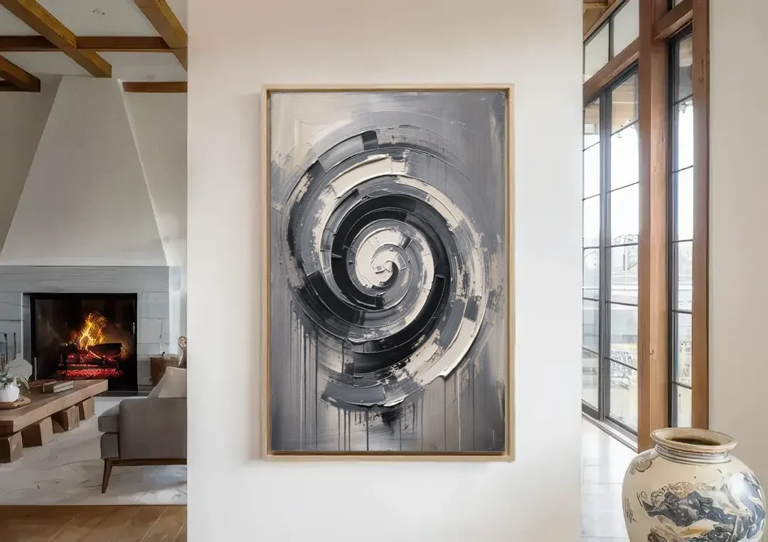 Modern Black and White Inward Spiral canvas wall art in a living room with a fireplace