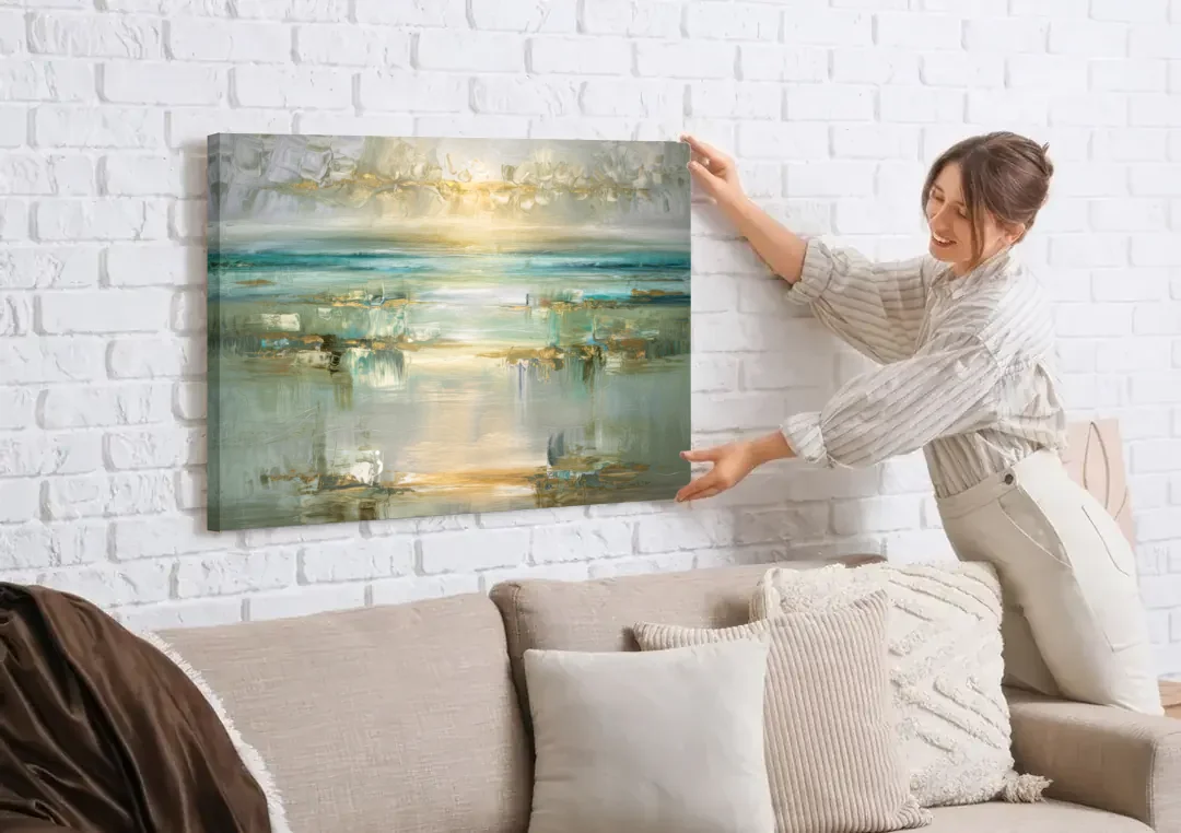 Irvine Coastal Serenity canvas wall art being hung on a white brick wall above a sofa