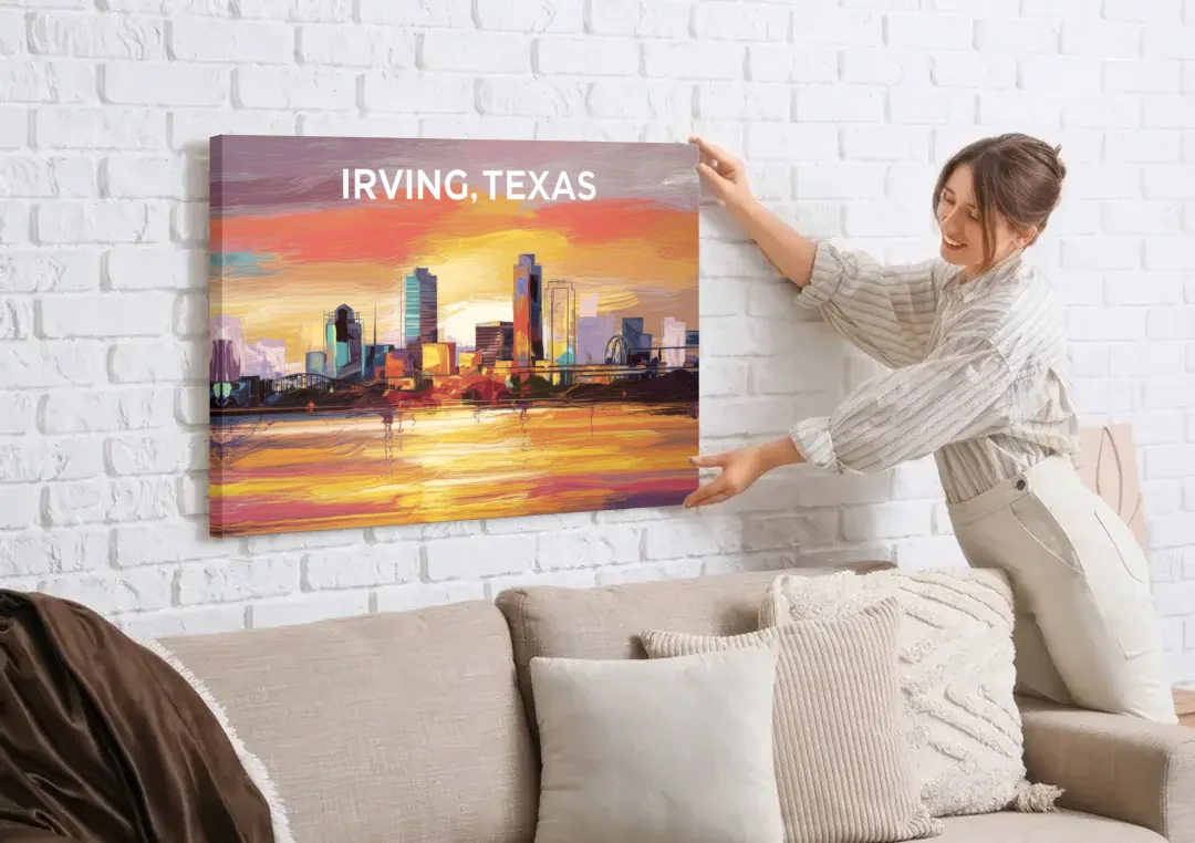 Irving Cityscape Sunset canvas wall art being hung on a white brick wall above a sofa
