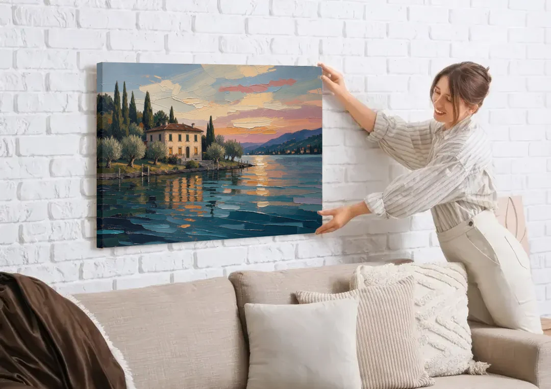 Italian Lakeside Villa at Dusk canvas wall art being hung on a white brick wall above a sofa