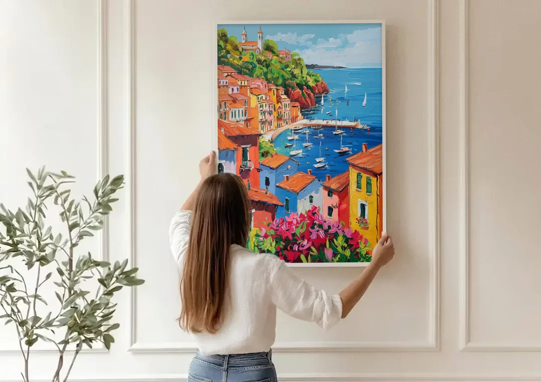 Italian Riviera Art with a Sailboat Harbor canvas wall art being hung on a paneled wall