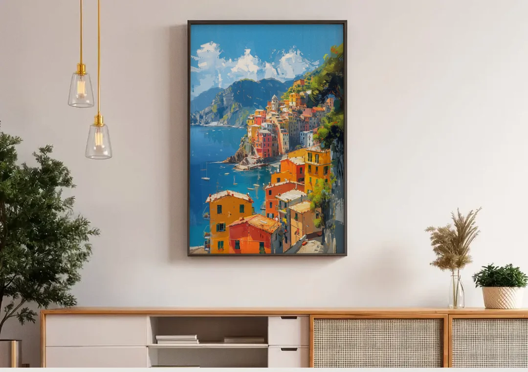 Italian Riviera Painting of a Harbor Village canvas wall art above a wooden sideboard under pendant lights
