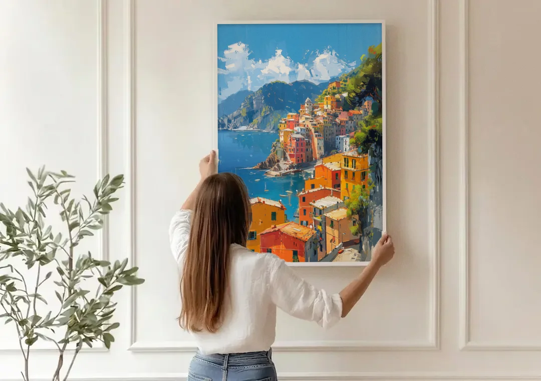 Italian Riviera Painting of a Harbor Village canvas wall art being hung on a paneled wall