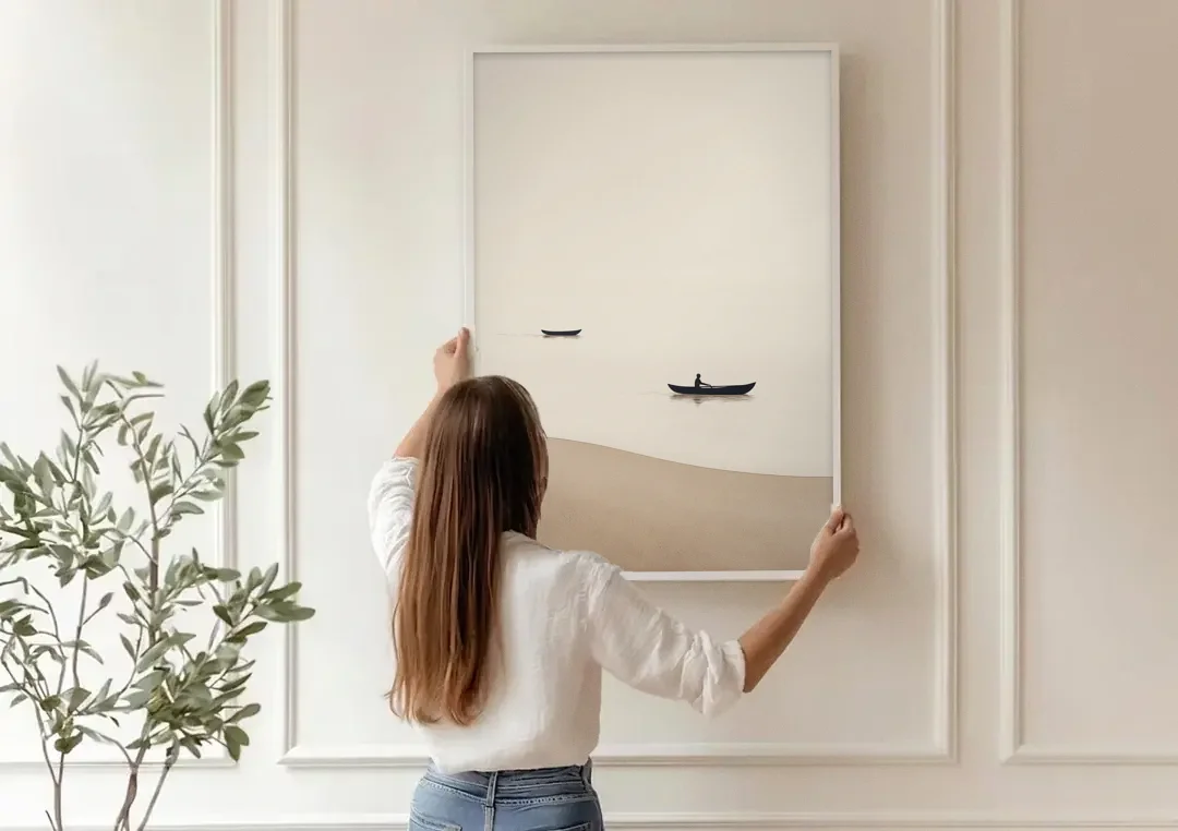 Ivory Wall Art with Two Boats Adrift canvas wall art being hung on a paneled wall