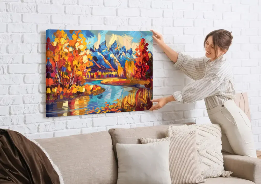 Jackson Hole Autumn Colors canvas wall art being hung on a white brick wall above a sofa