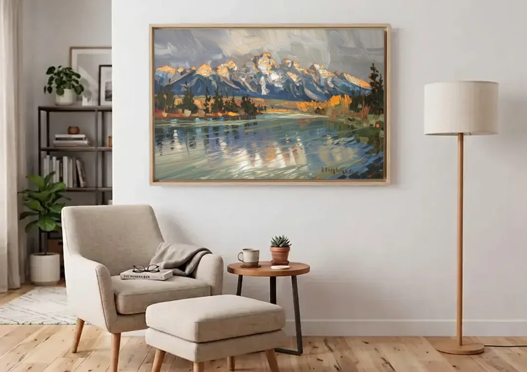 Jackson Hole River Reflection canvas wall art above an armchair in a bright living room