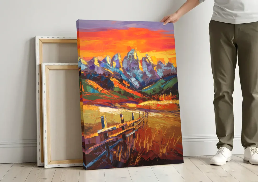 Jackson Hole Sunset Glow canvas wall art leaning against a wall next to blank canvases