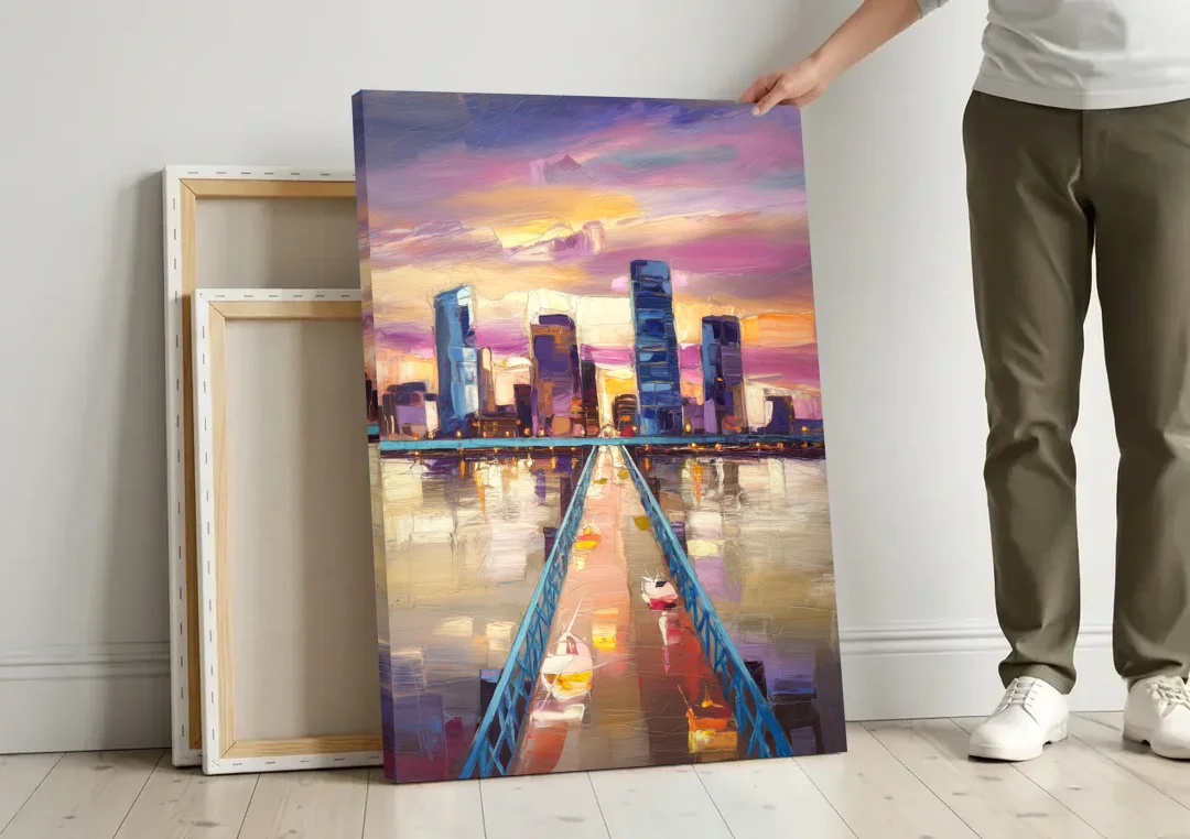 Jacksonville Downtown Views canvas wall art leaning against a wall next to blank canvases