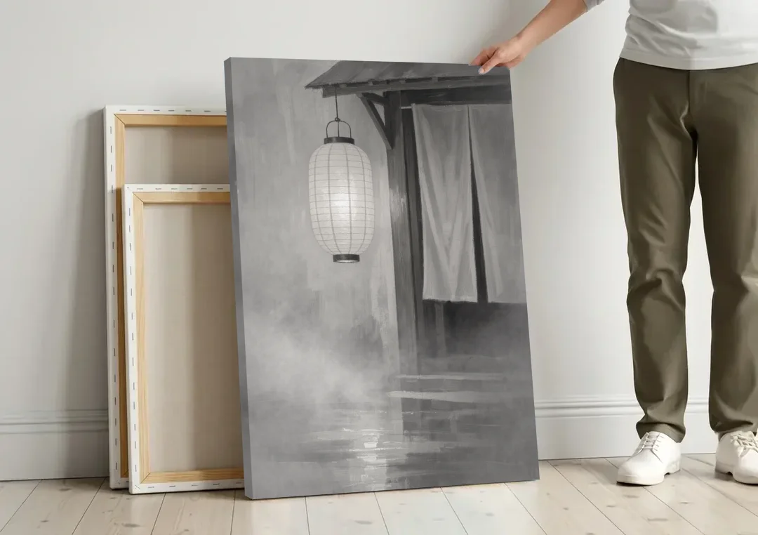 Japanese Lantern Painting by a Misty Doorway canvas wall art leaning against a wall next to blank canvases
