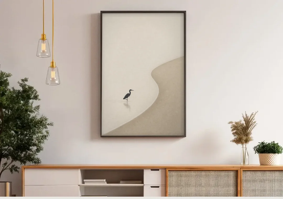 Japanese Minimalist Art of a Heron in the Shallows canvas wall art above a wooden sideboard under pendant lights
