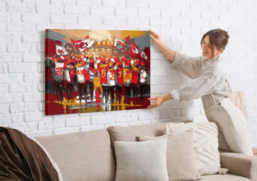 Kansas City Chiefs Fans Gathering canvas wall art being hung on a white brick wall above a sofa