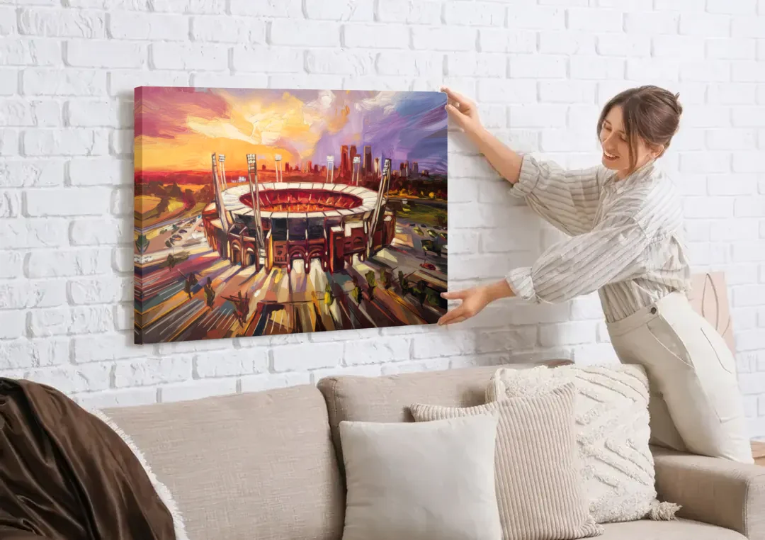 Kansas City Chiefs Stadium canvas wall art being hung on a white brick wall above a sofa