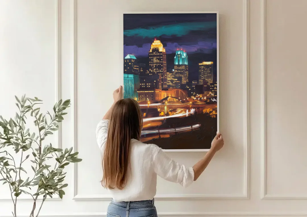 Kansas City Nighttime Skyline canvas wall art being hung on a paneled wall