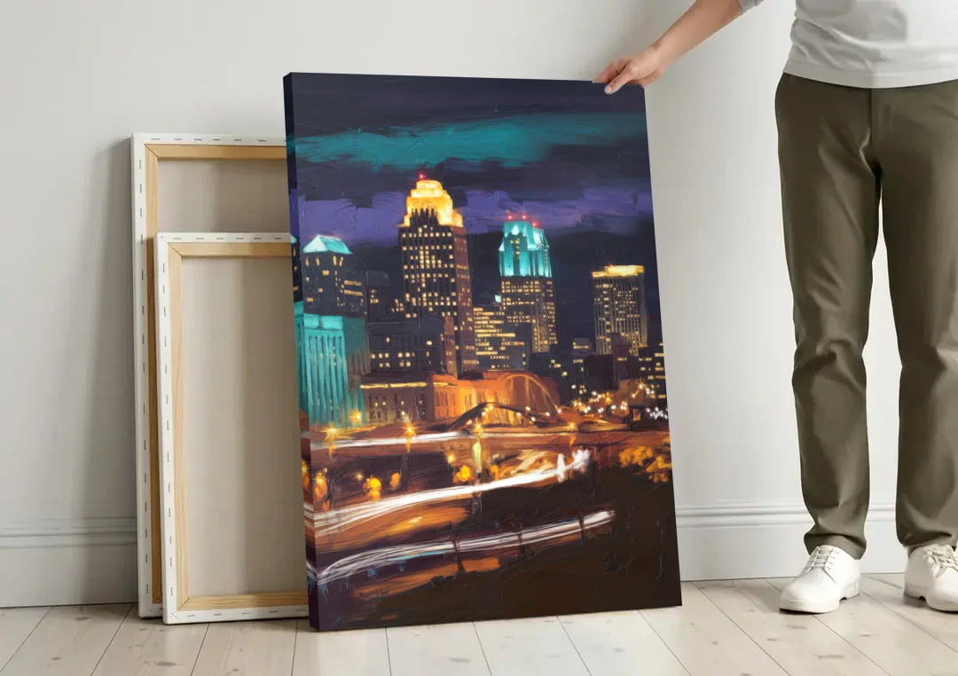 Kansas City Nighttime Skyline canvas wall art leaning against a wall next to blank canvases