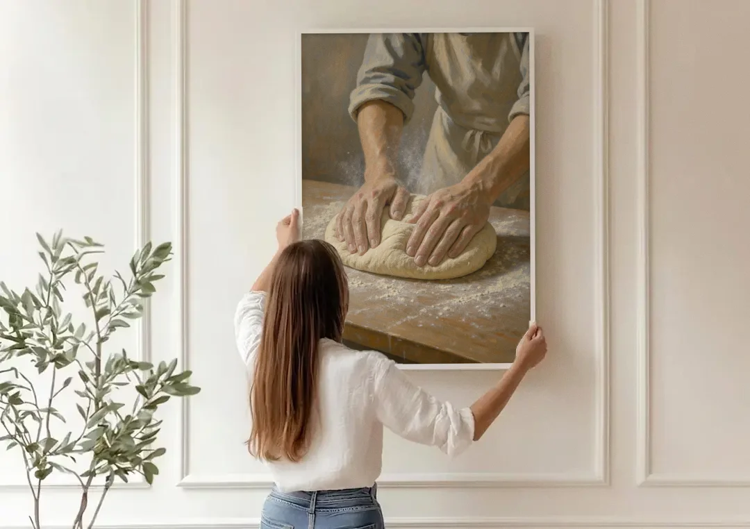 Kitchen Canvas Art of Hands Kneading Bread Dough canvas wall art being hung on a paneled wall
