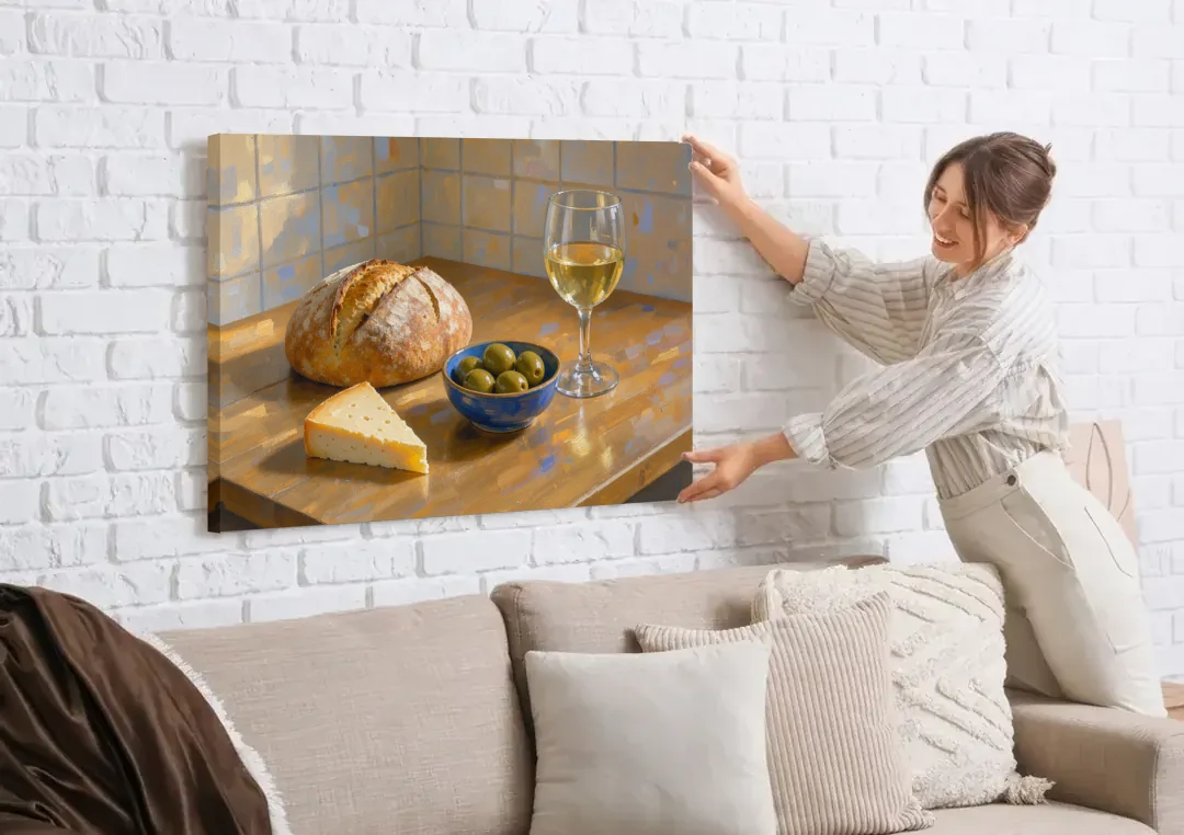Kitchen Table Painting with Bread, Olives and Wine canvas wall art being hung on a white brick wall above a sofa